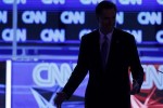 Republican presidential candidate Massachusetts Governor Mitt Romney leaves his podium during a break in the Republican presidential candidates debate in Jacksonville.
