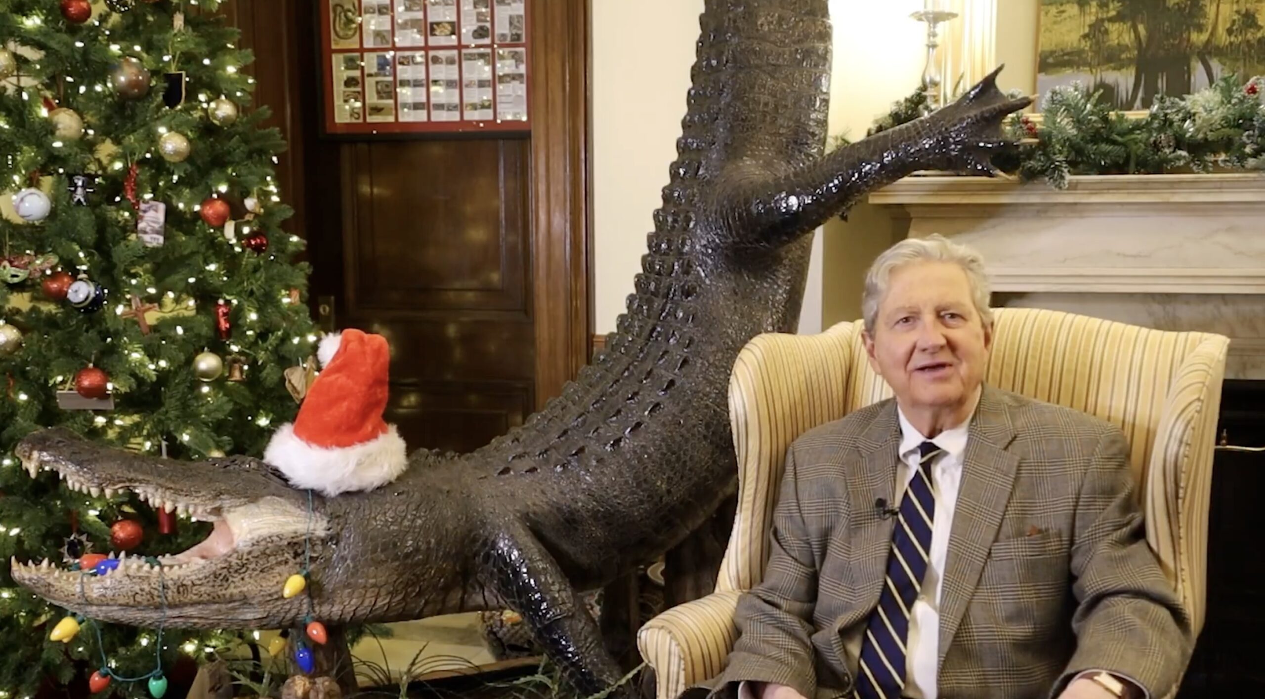 Senator Offers Holiday Wishes While Sitting Next to Taxidermied Alligator: You Can Find God's Love Everywhere'